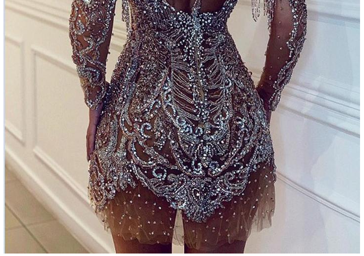 Dress with round neck and long sleeves and sequins