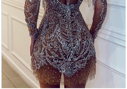 Dress with round neck and long sleeves and sequins